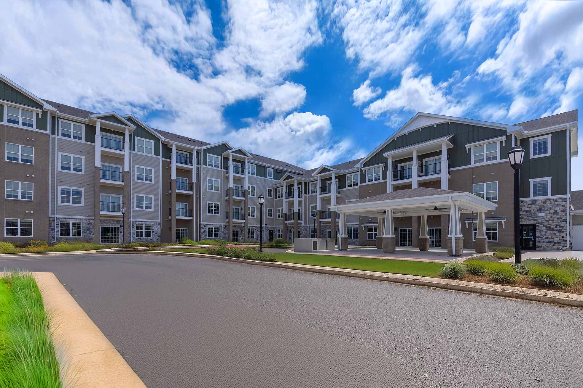 Photo of The Barrymore Senior Living's exterior under a bright blue sky.